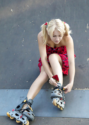 Adorable blonde with twin tails loves roller skates and showing her assets